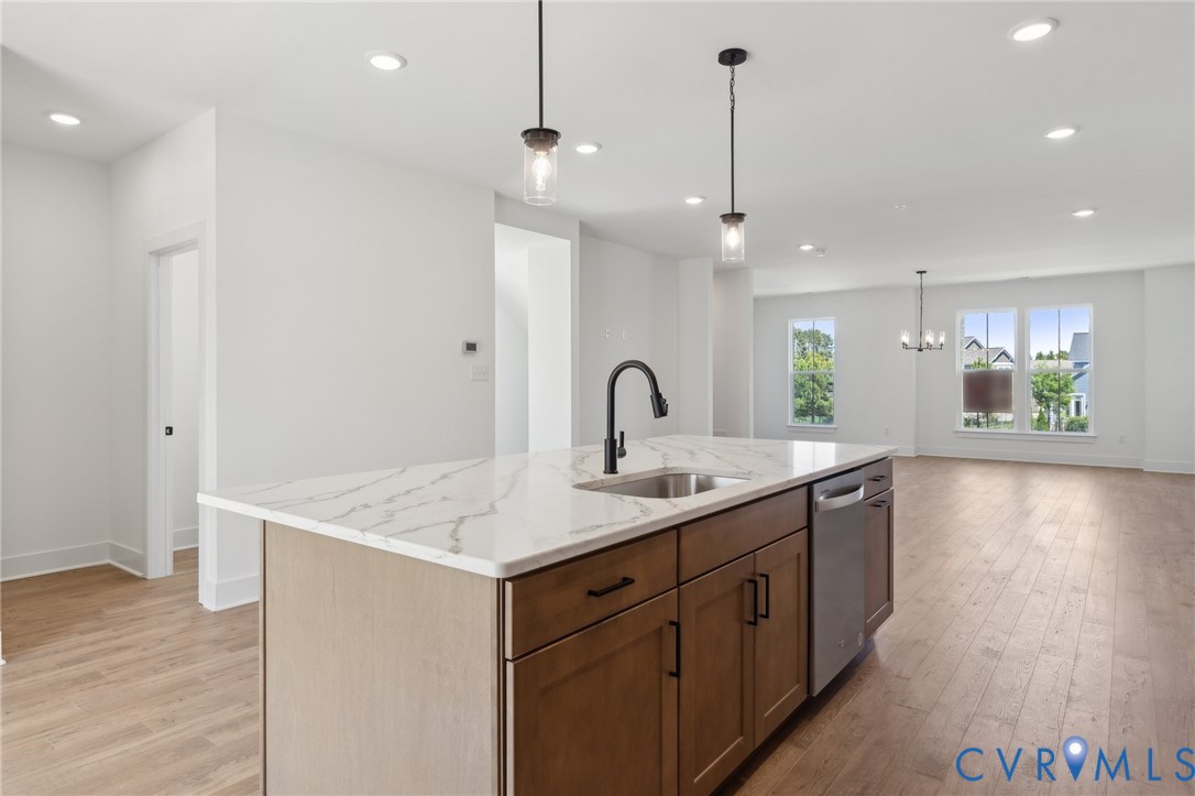 12014 Afternoon Path Henrico, VA 23233 - Photo 12 of 30 a kitchen with a sink a counter space appliances and wooden floor