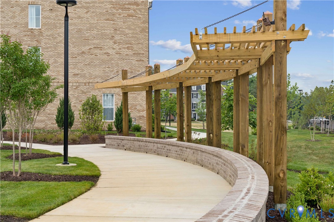 12014 Afternoon Path Henrico, VA 23233 - Photo 29 of 30 a view of a house with a porch and a table and chairs