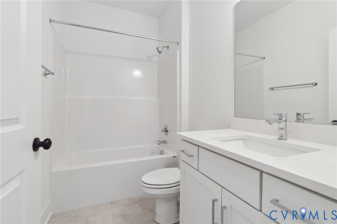 12014 Afternoon Path Henrico, VA 23233 - Photo 3 of 30 a bathroom with a sink toilet vanity and shower