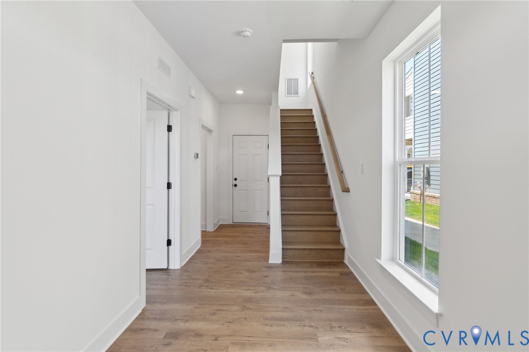 12014 Afternoon Path Henrico, VA 23233 - Photo 4 of 30 a view of a hallway with wooden floor and entryway