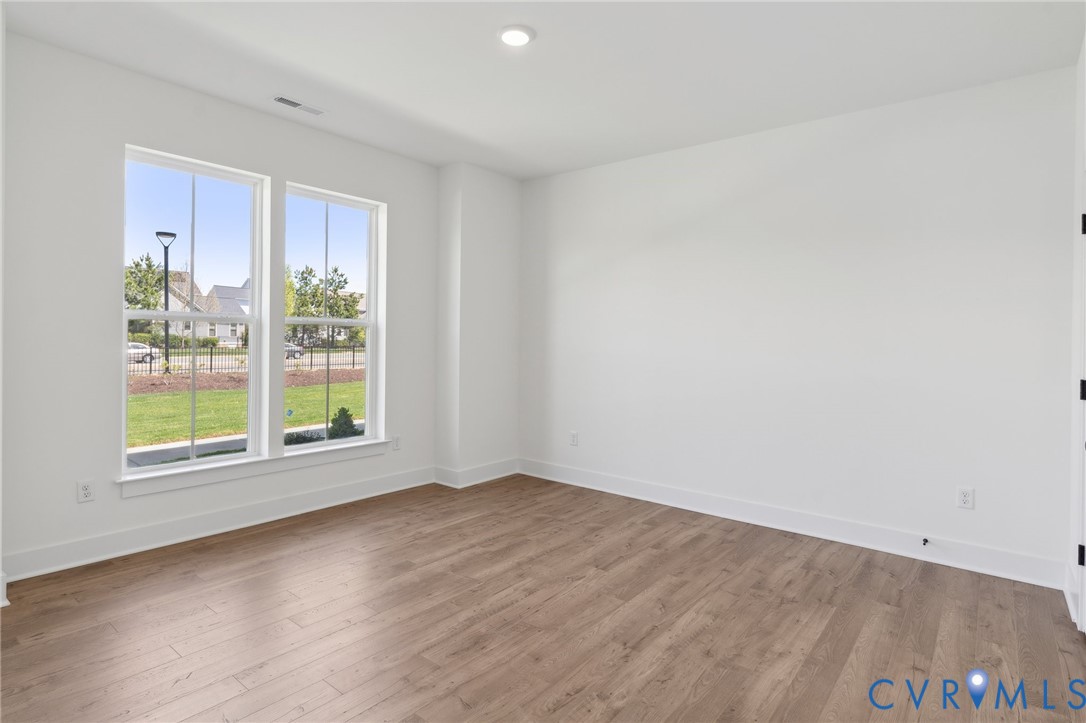 12014 Afternoon Path Henrico, VA 23233 - Photo 5 of 30 an empty room with wooden floor and windows
