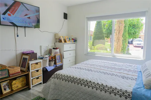 a bed room with a bed and a window