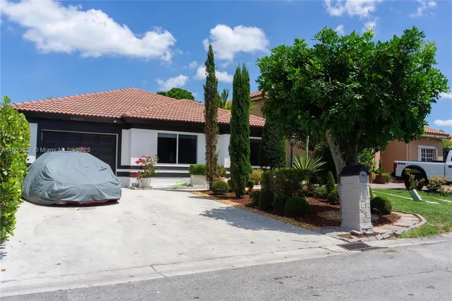 a house view with a garden space