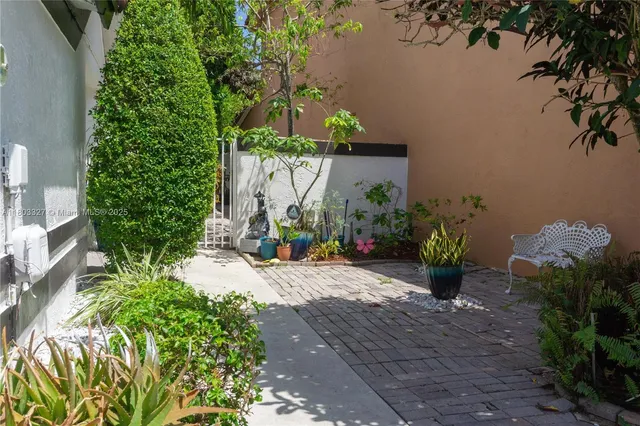 a wooden fence with some plants