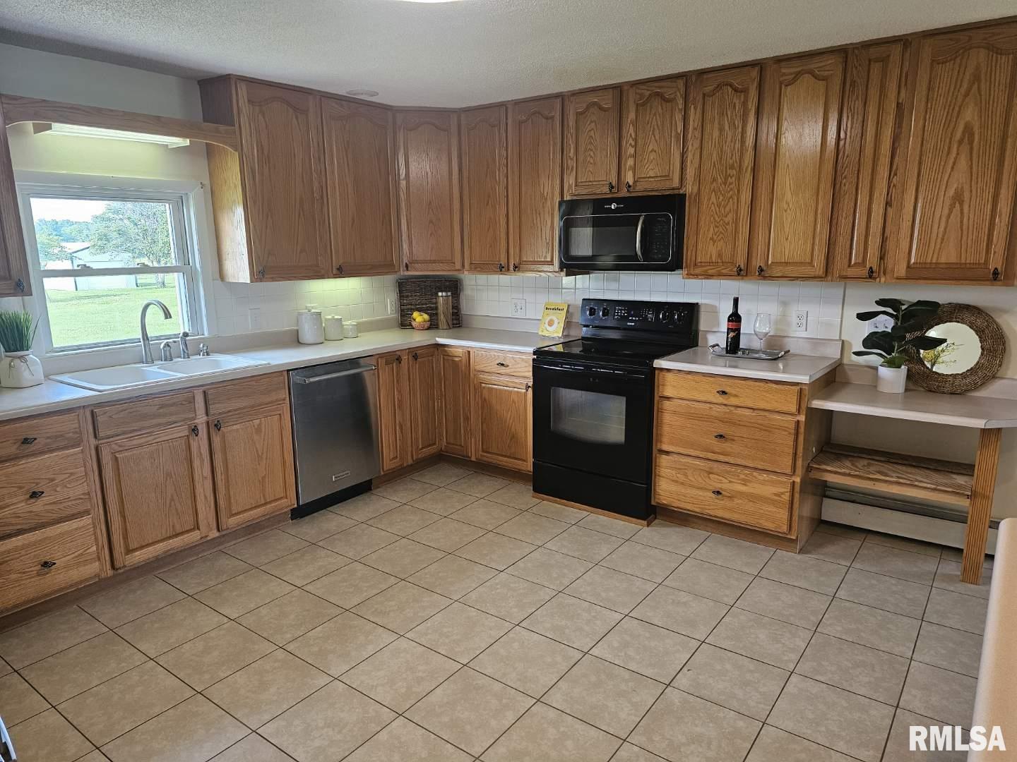 16485 East Robin Road Mount Vernon, IL 62864 - Photo 29 of 51 a kitchen with stainless steel appliances granite countertop a stove and a sink