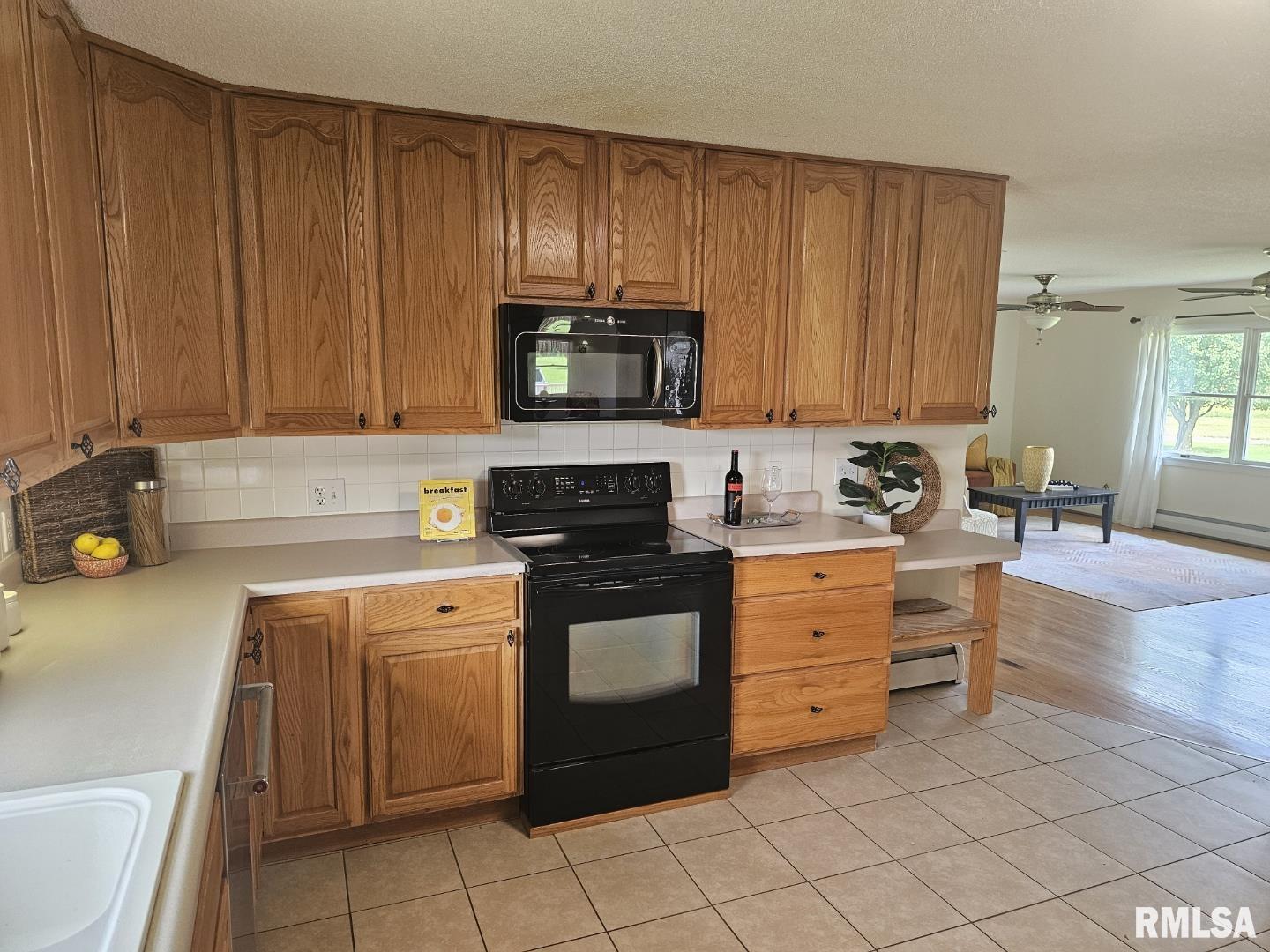 16485 East Robin Road Mount Vernon, IL 62864 - Photo 33 of 51 a kitchen with a stove top oven sink and cabinets