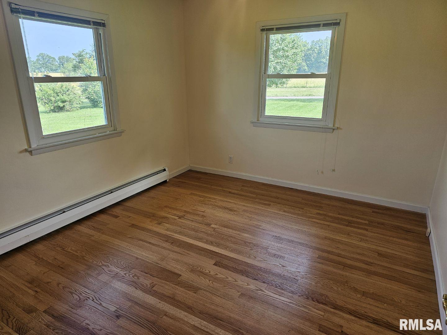 16485 East Robin Road Mount Vernon, IL 62864 - Photo 40 of 51 an empty room with wooden floor and windows