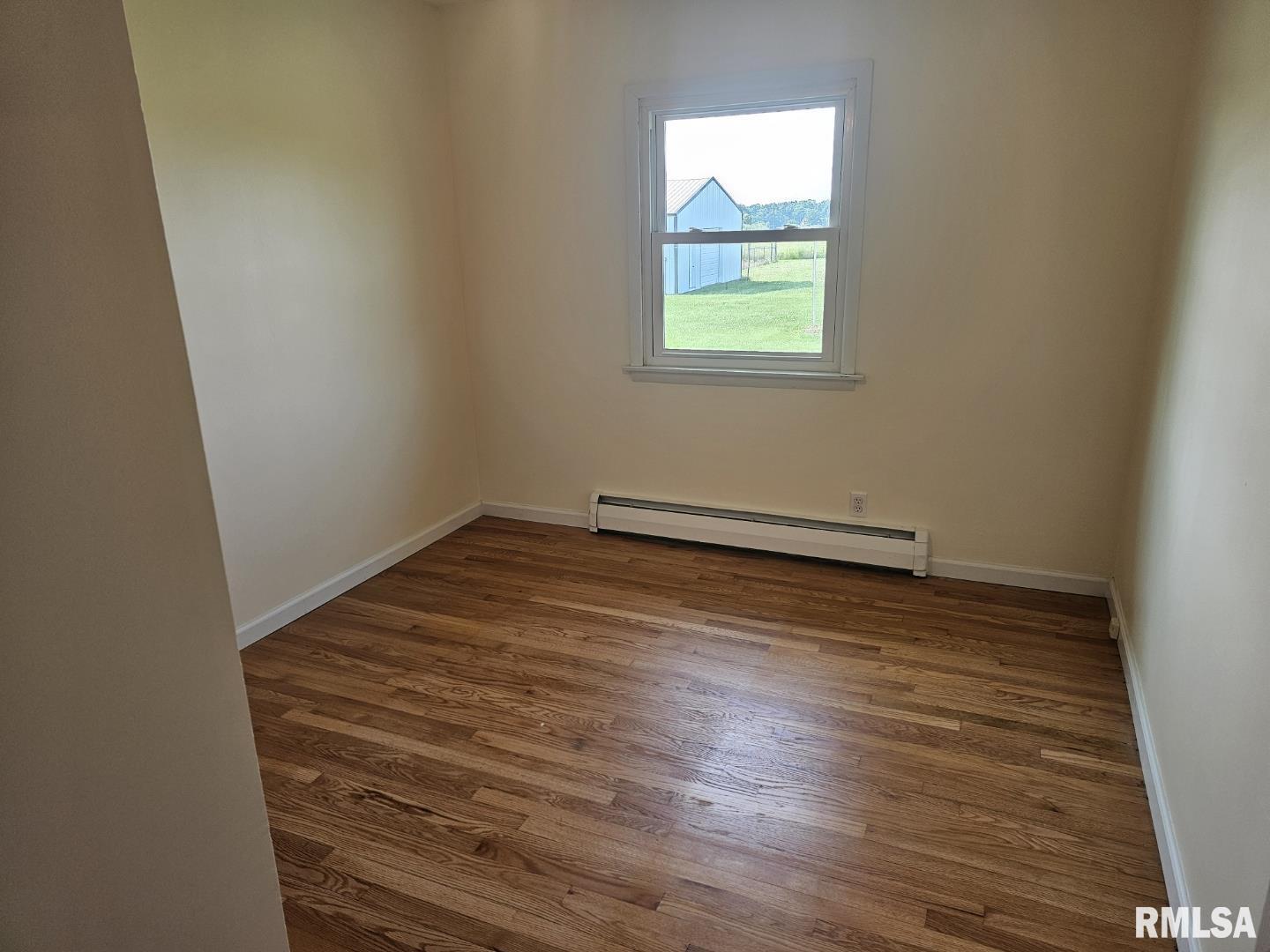 16485 East Robin Road Mount Vernon, IL 62864 - Photo 43 of 51 an empty room with wooden floor and windows