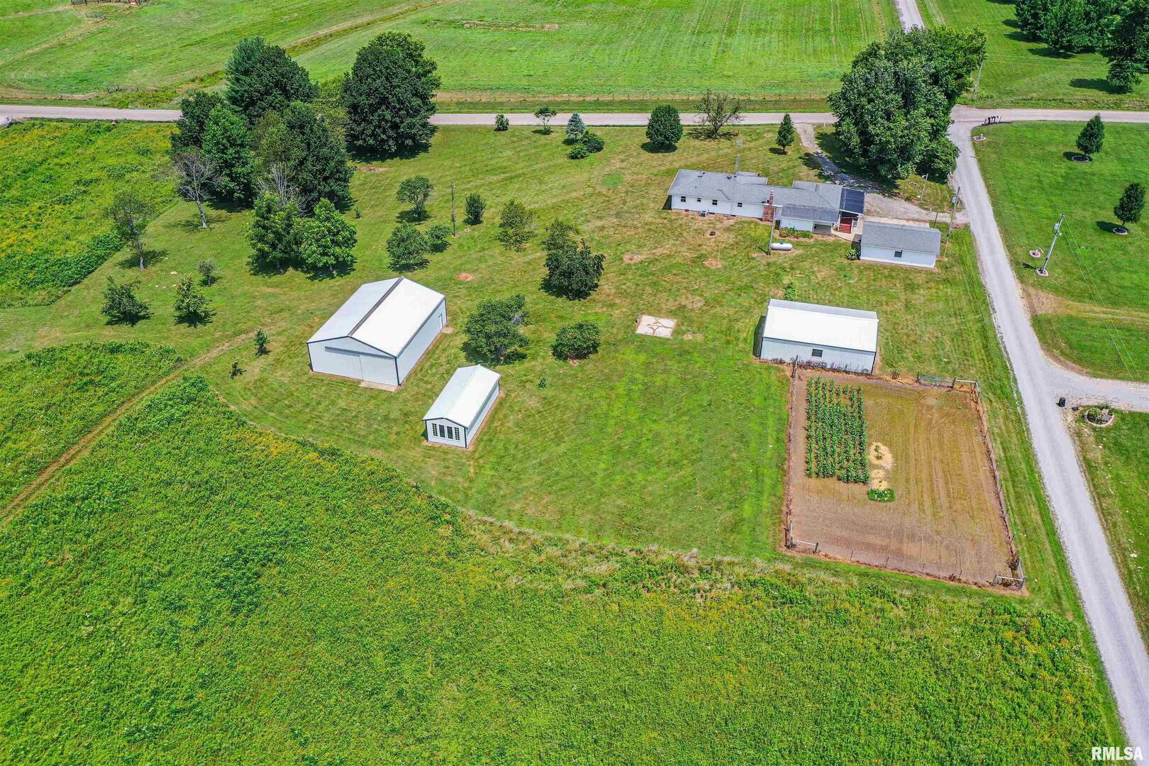 16485 East Robin Road Mount Vernon, IL 62864 - Photo 6 of 51 an aerial view of a house with pool yard seating area and yard