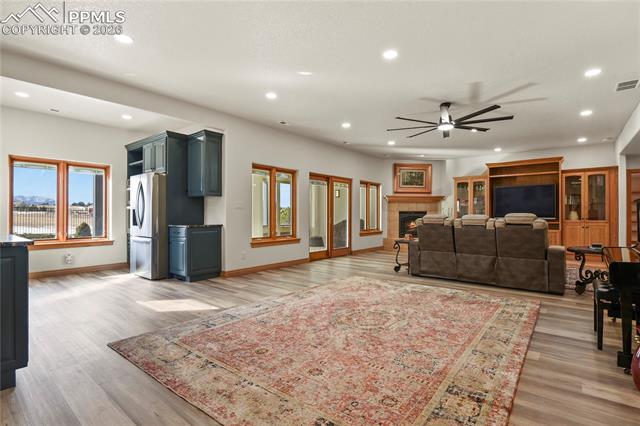 5220 Roundup Ridge Road Colorado Springs, CO 80908 - Photo 23 of 50 Lower level family room, new LVP flooring and new lighting