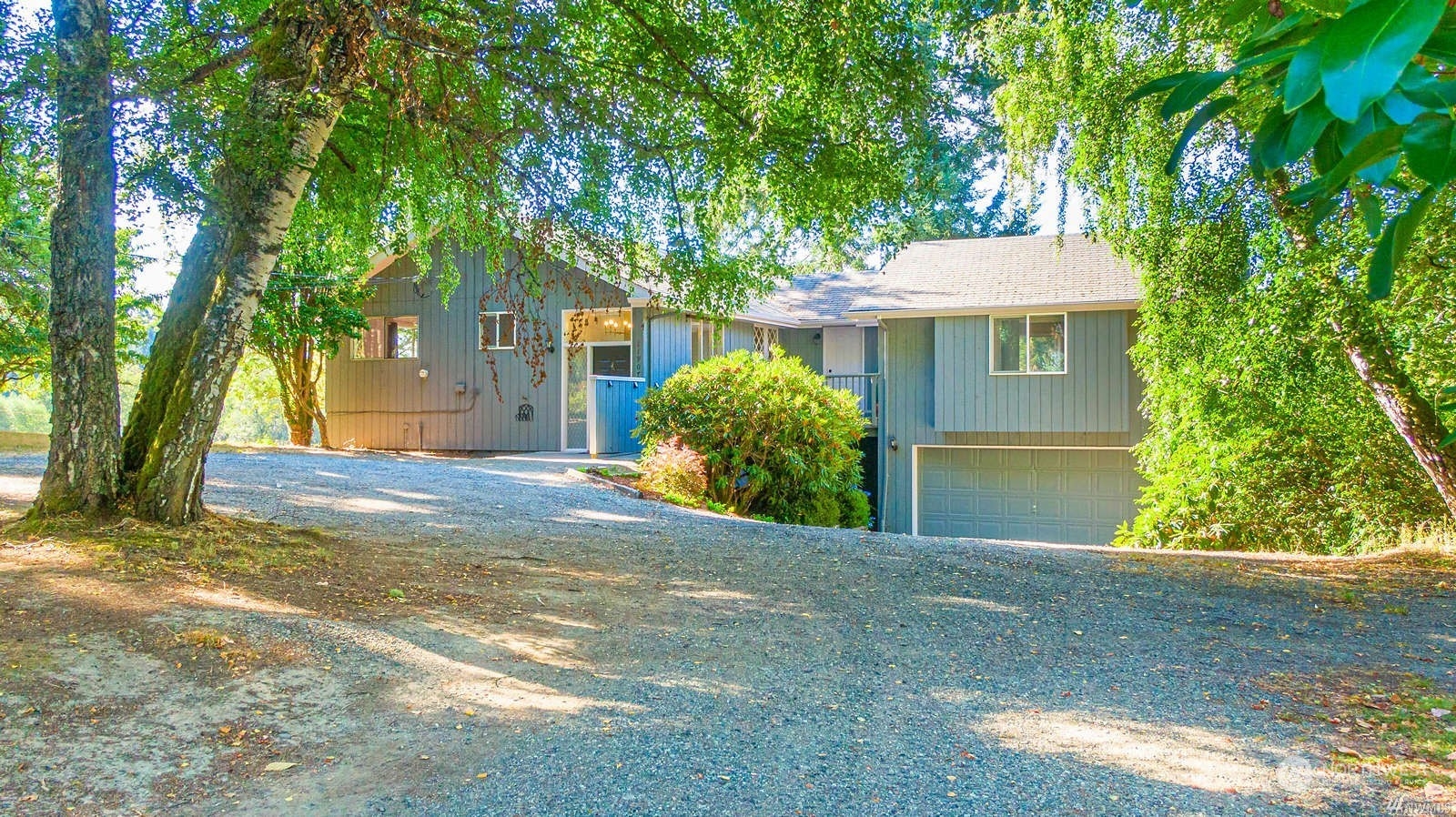 11907 Southwest Cemetery Road Vashon, WA 98070 - Photo 1 of 1 a view of a house with a tree