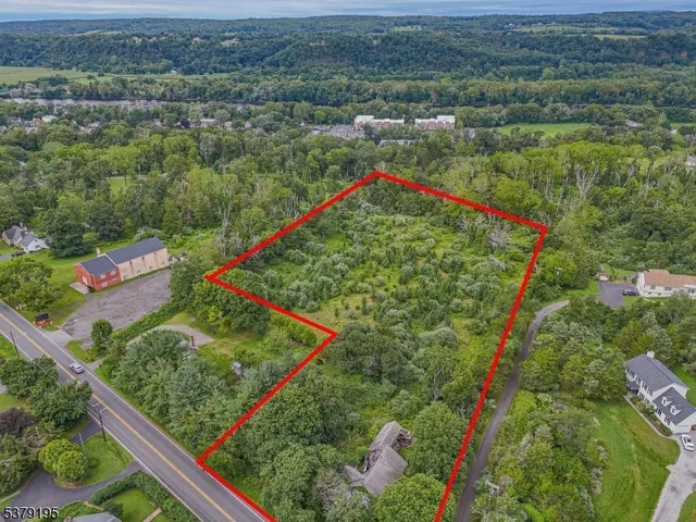 an aerial view of a house with lots of trees