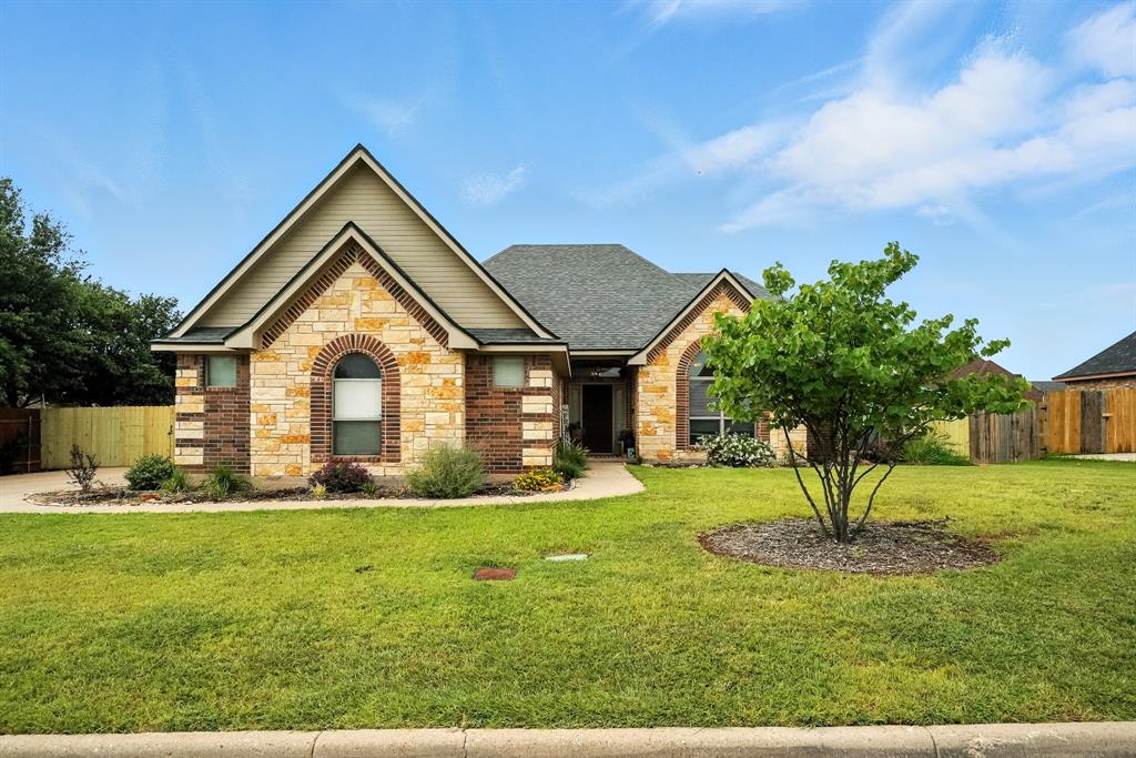 4409 High Sierra Abilene, TX 79606 - Photo 1 of 1 a front view of a house with garden