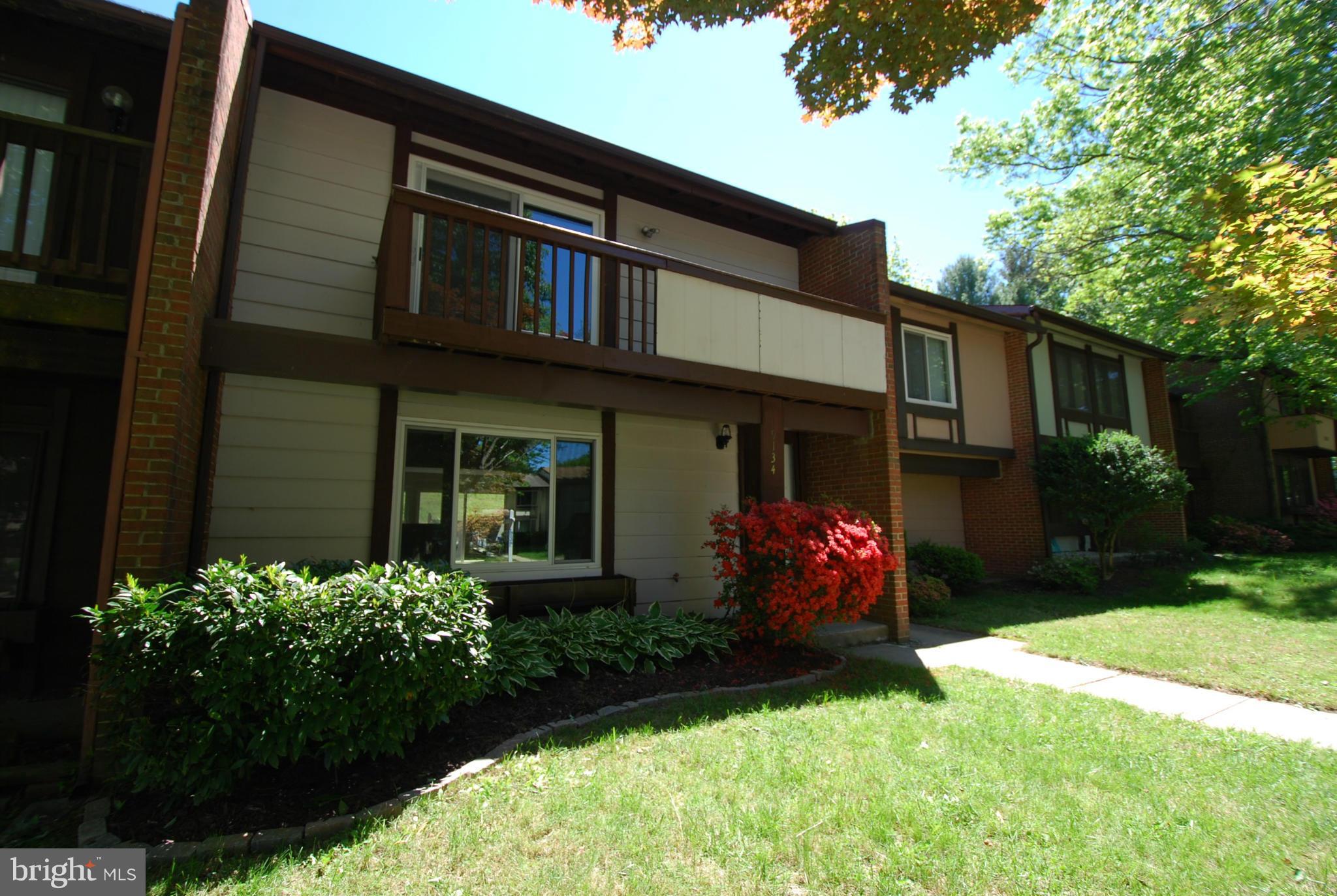 9134 Centerway Road Gaithersburg, MD 20879 - Photo 2 of 18 a front view of a house with garden