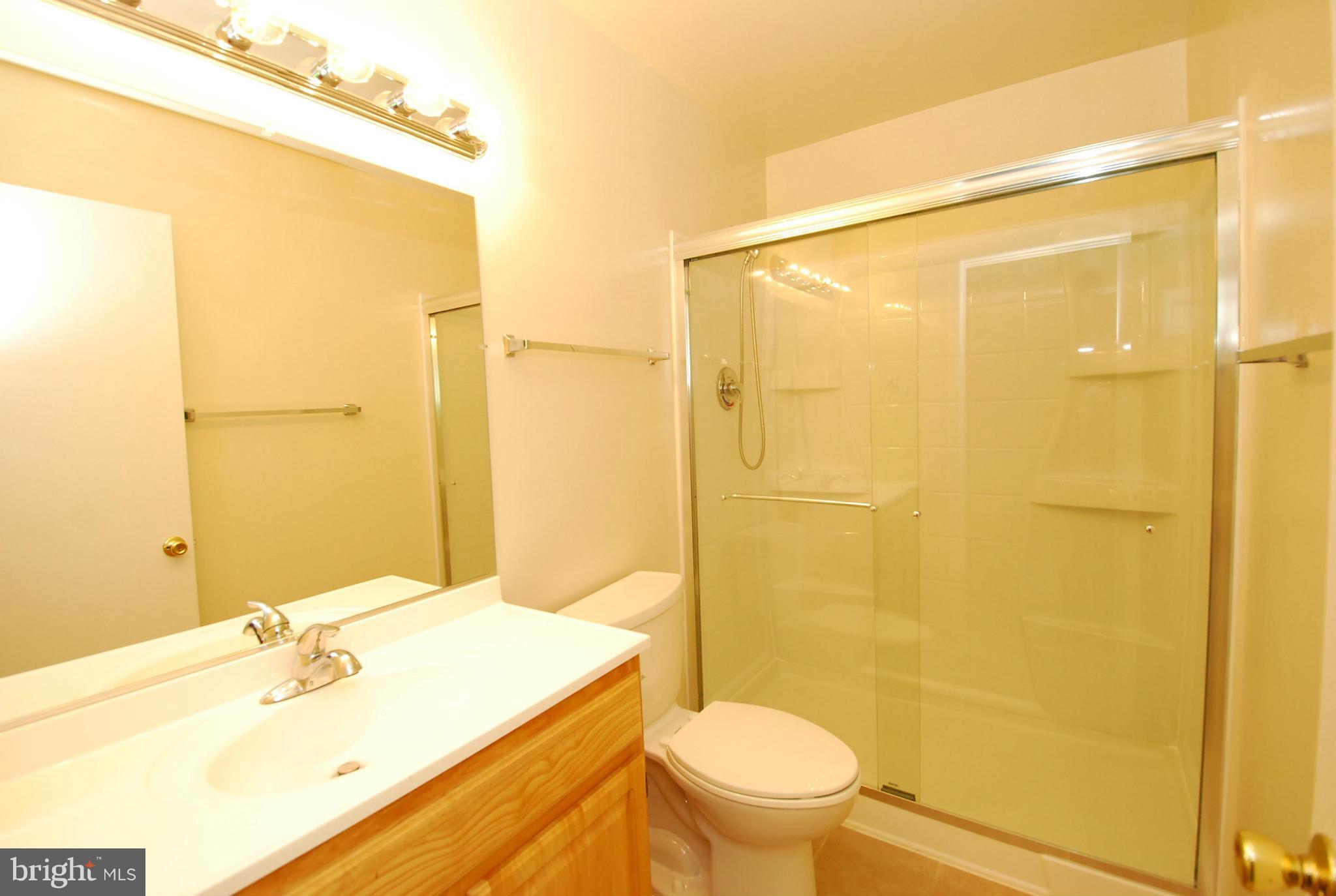 9134 Centerway Road Gaithersburg, MD 20879 - Photo 11 of 18 a bathroom with a sink and a mirror