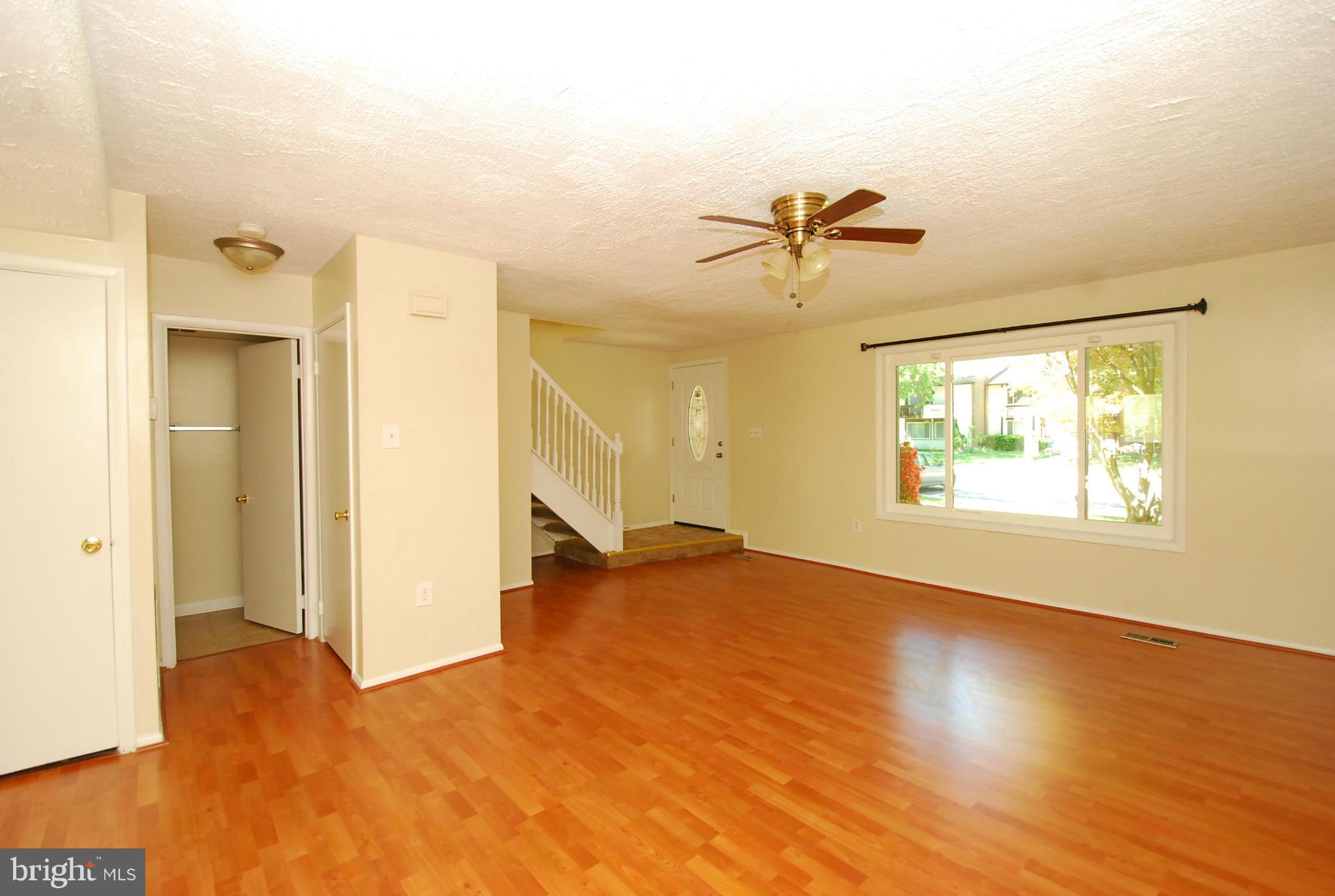 9134 Centerway Road Gaithersburg, MD 20879 - Photo 4 of 18 a view of a room with a window and a ceiling fan