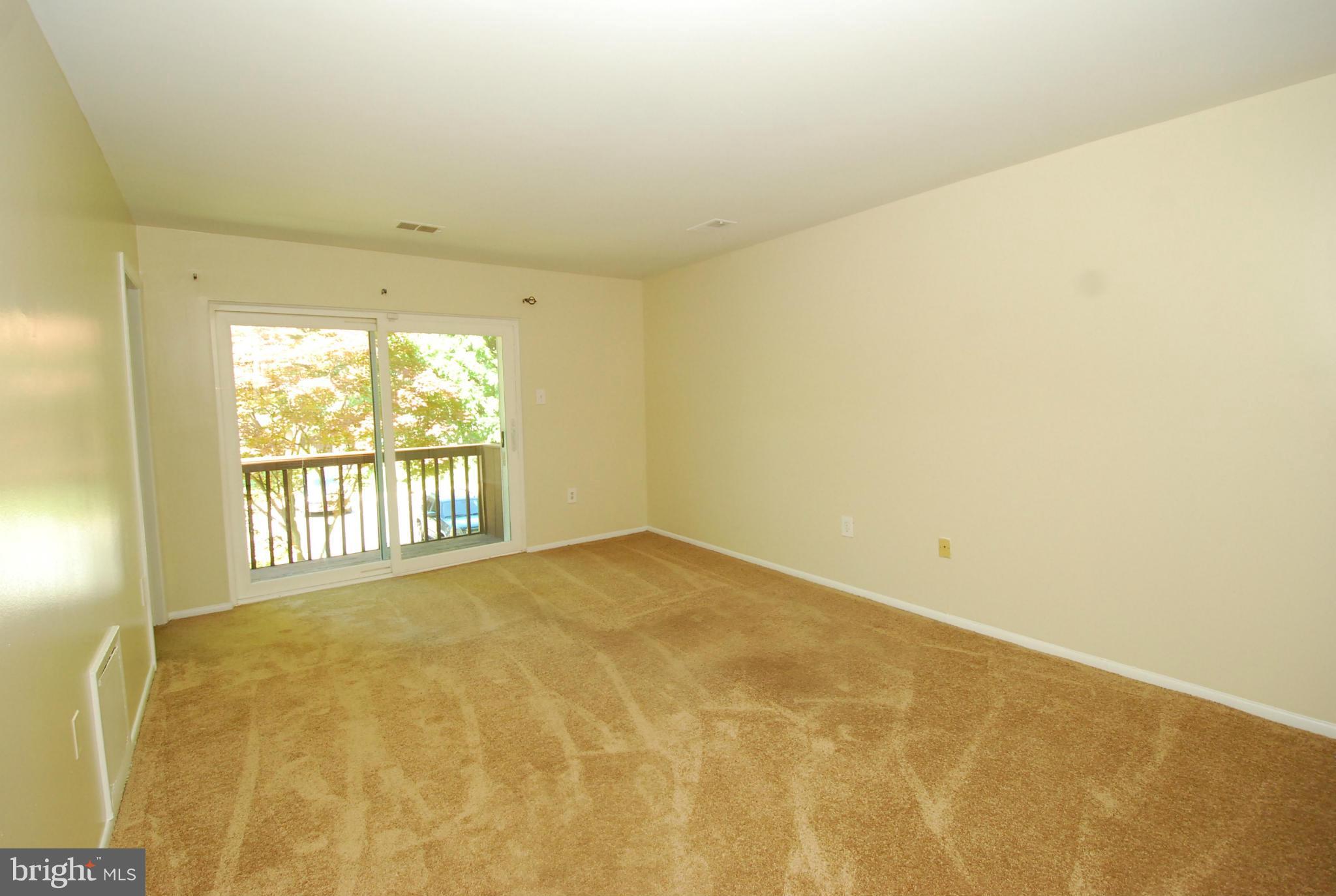 9134 Centerway Road Gaithersburg, MD 20879 - Photo 9 of 18 a view of an empty room and a window