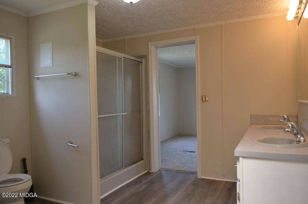171 Dillon Road Butler, GA 31006 - Photo 14 of 22 a bathroom with a sink and toilet