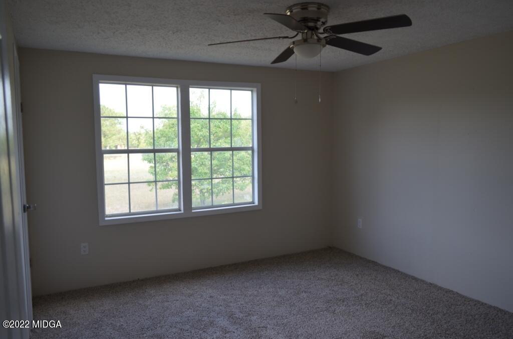 171 Dillon Road Butler, GA 31006 - Photo 16 of 22 an empty room with a window