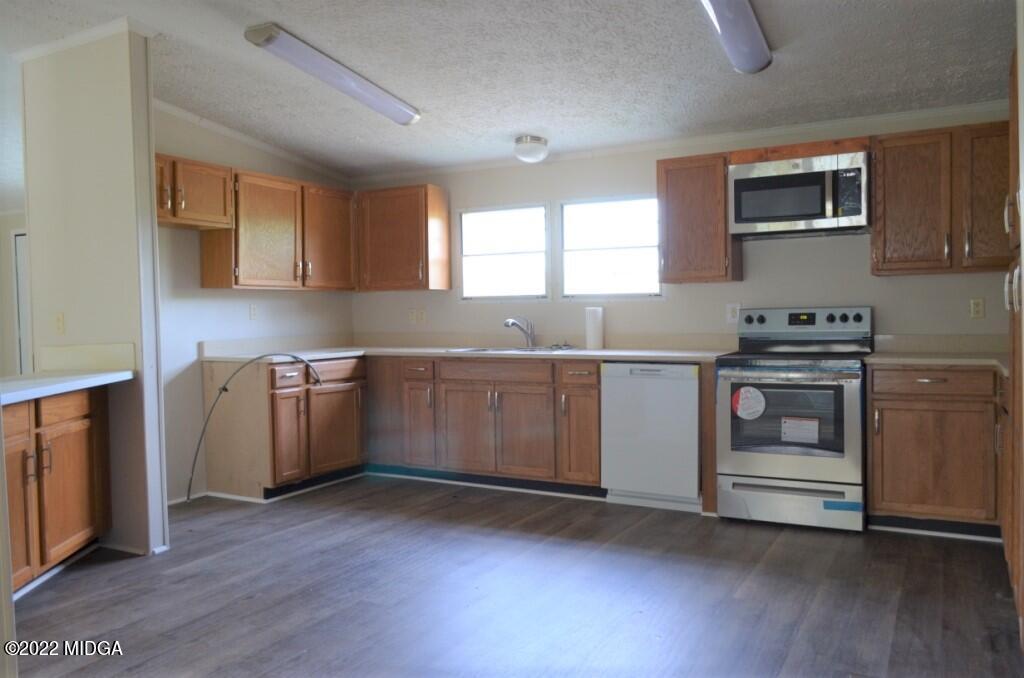 171 Dillon Road Butler, GA 31006 - Photo 10 of 22 a kitchen with a stove and a sink
