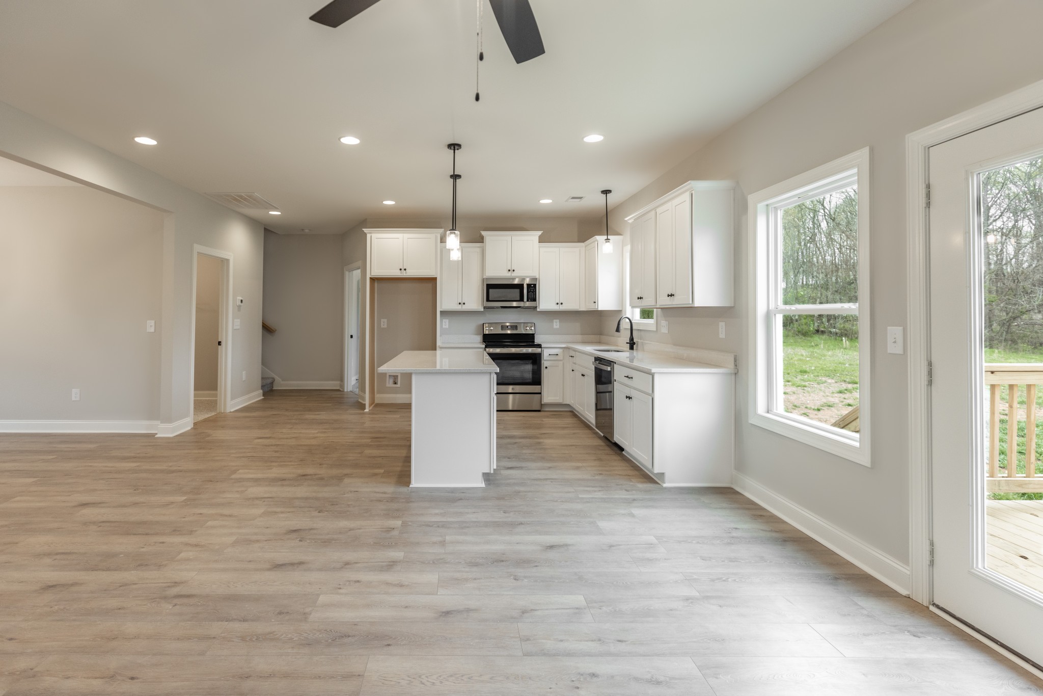 340 Woodruff Road Adams, TN 37010 - Photo 5 of 15 a kitchen with stainless steel appliances kitchen island granite countertop a refrigerator and cabinets