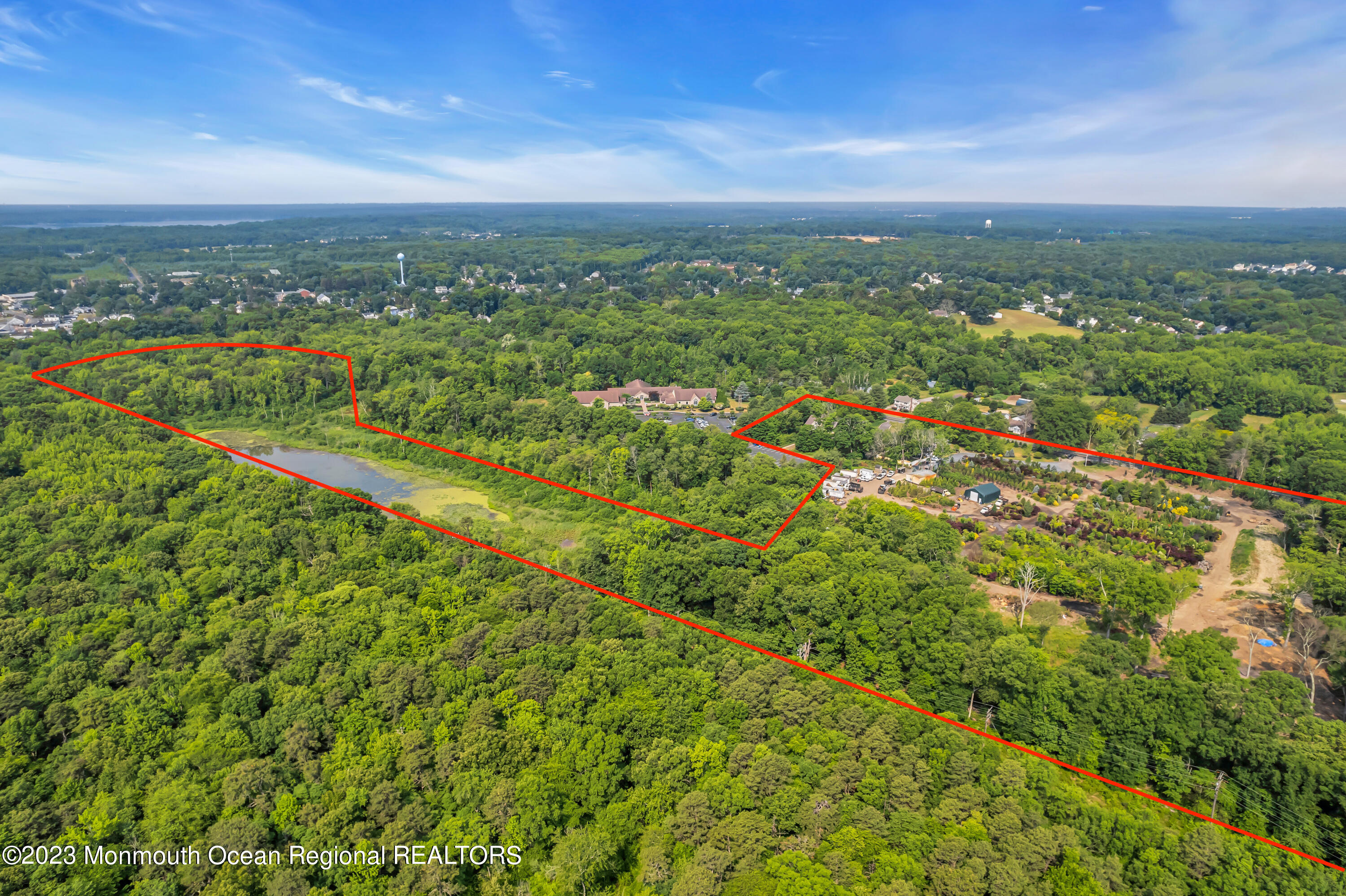 51 Asbury Road Farmingdale, NJ 07727 - Photo 13 of 17 a view of a city with lush green forest