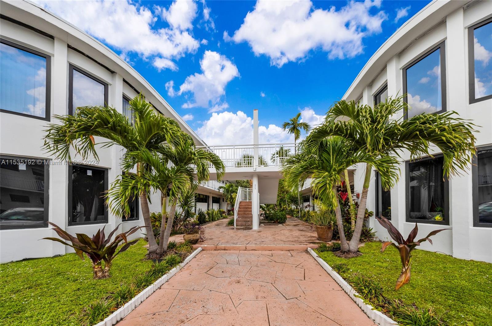 235 78th Street Miami Beach, FL 33141 - Photo 1 of 36 a view of a house with palm trees
