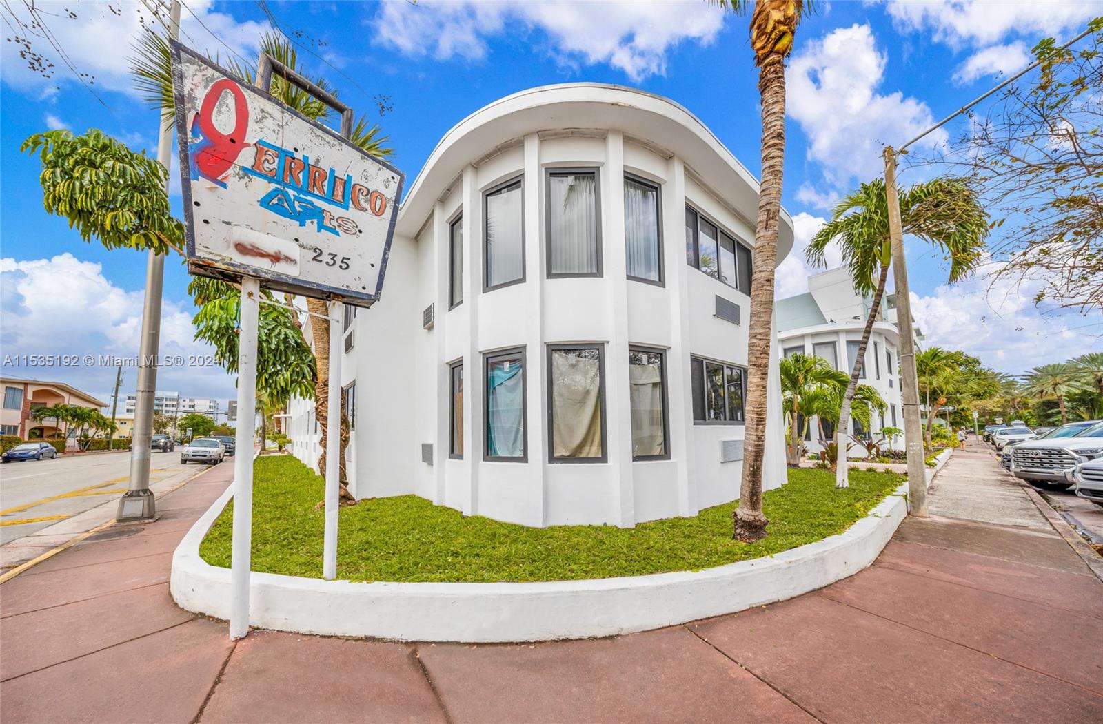 235 78th Street Miami Beach, FL 33141 - Photo 3 of 36 a view of a white building with a swimming pool