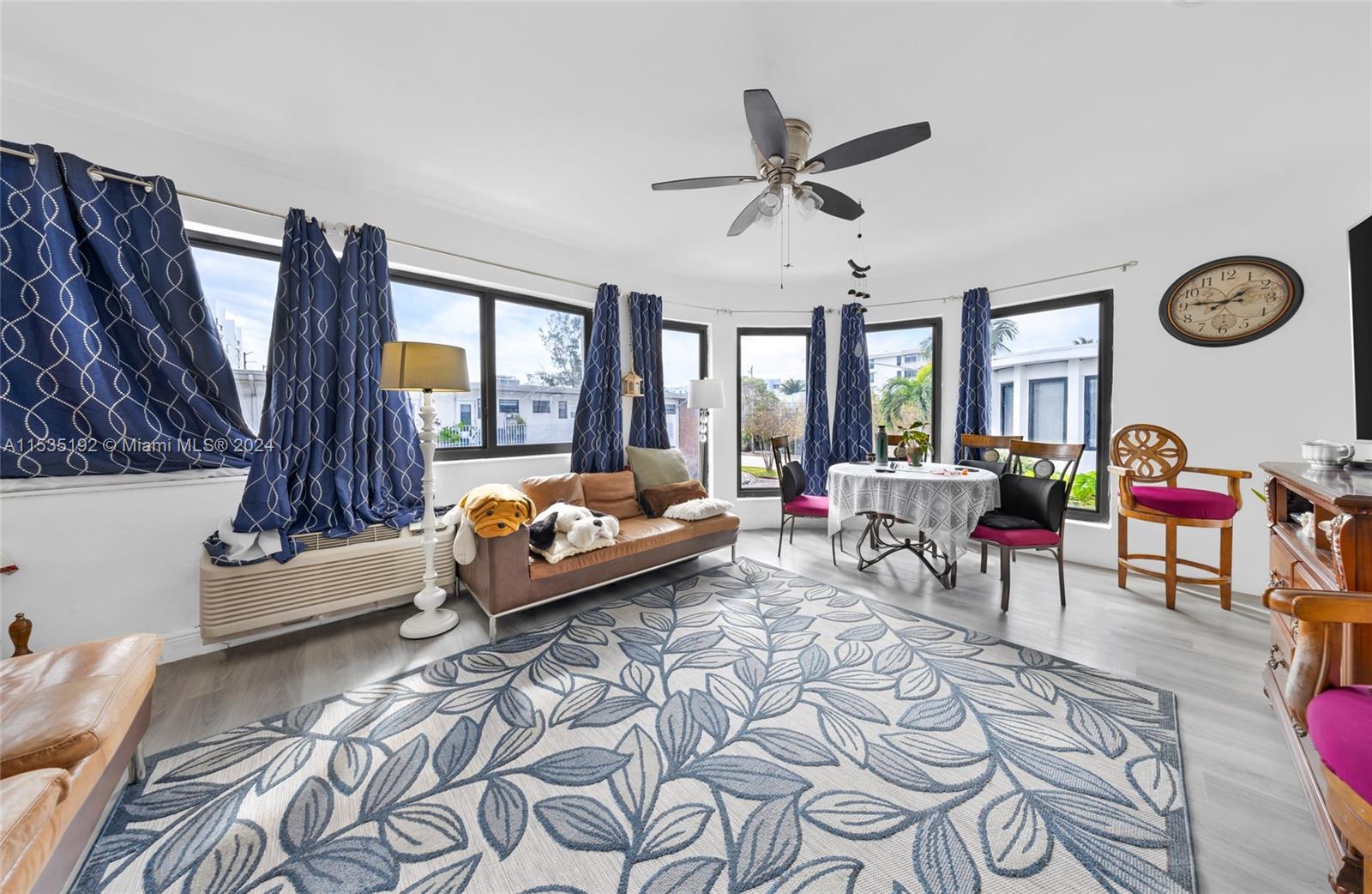 235 78th Street Miami Beach, FL 33141 - Photo 32 of 36 a living room with furniture and a window