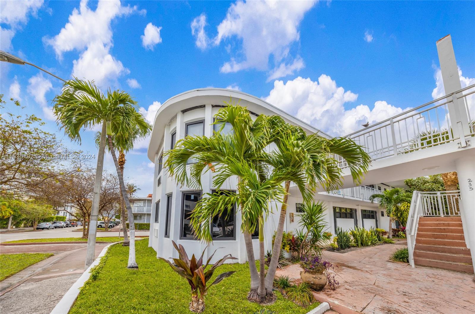 235 78th Street Miami Beach, FL 33141 - Photo 4 of 36 a front view of a house with garden