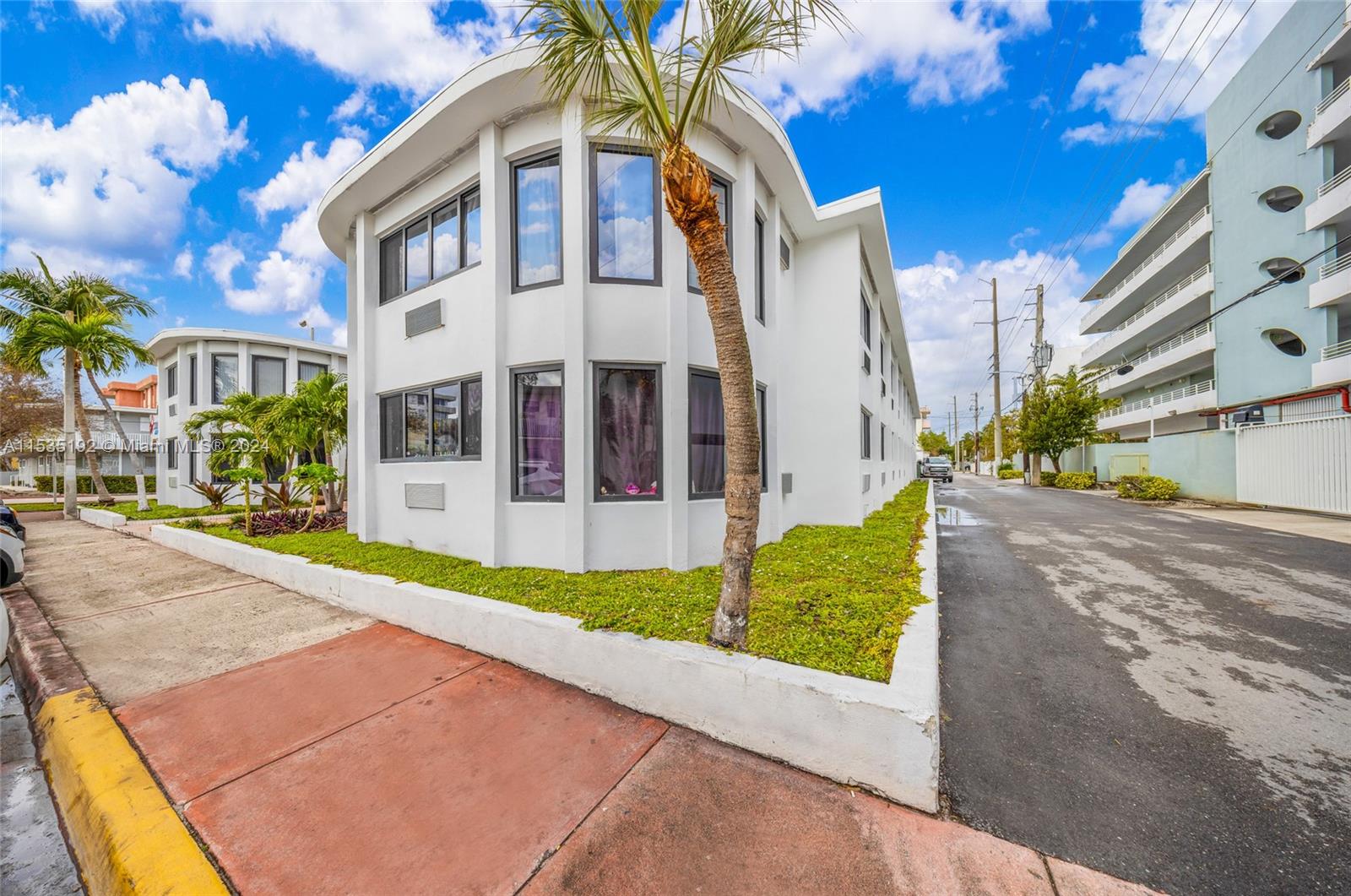 235 78th Street Miami Beach, FL 33141 - Photo 5 of 36 a view of a building with a street