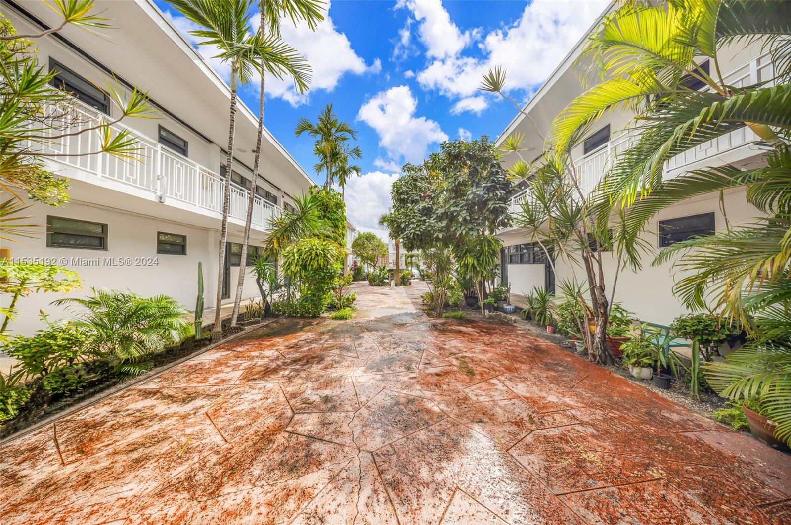 235 78th Street Miami Beach, FL 33141 - Photo 6 of 36 a view of a pathway with a house