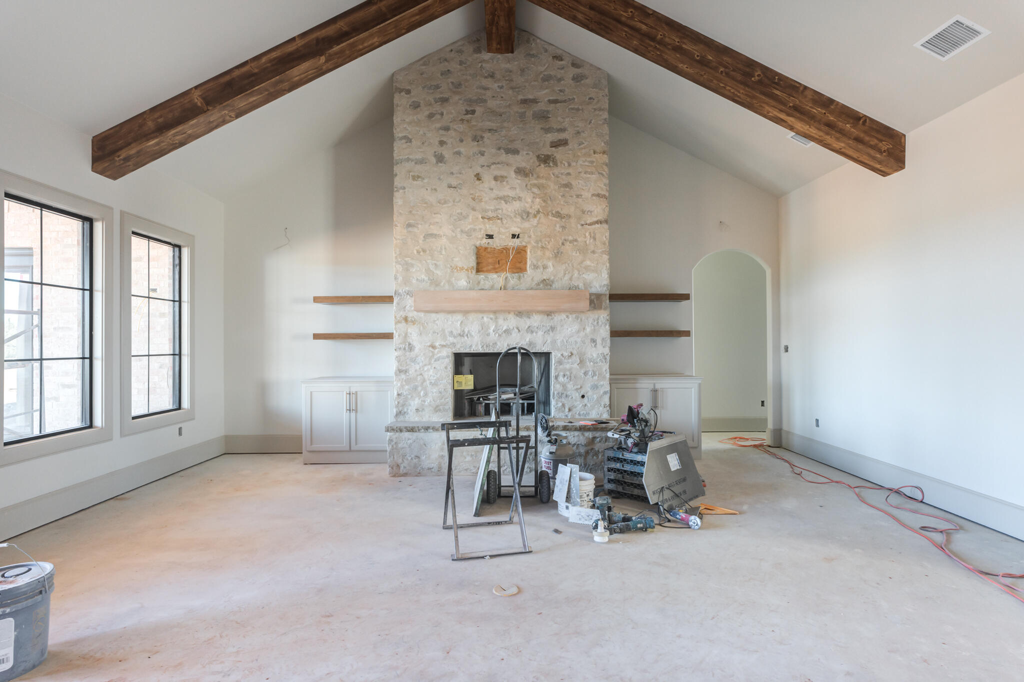 6309 Foster Road Ropesville, TX 79358 - Photo 14 of 38 an empty room with furniture and a fireplace