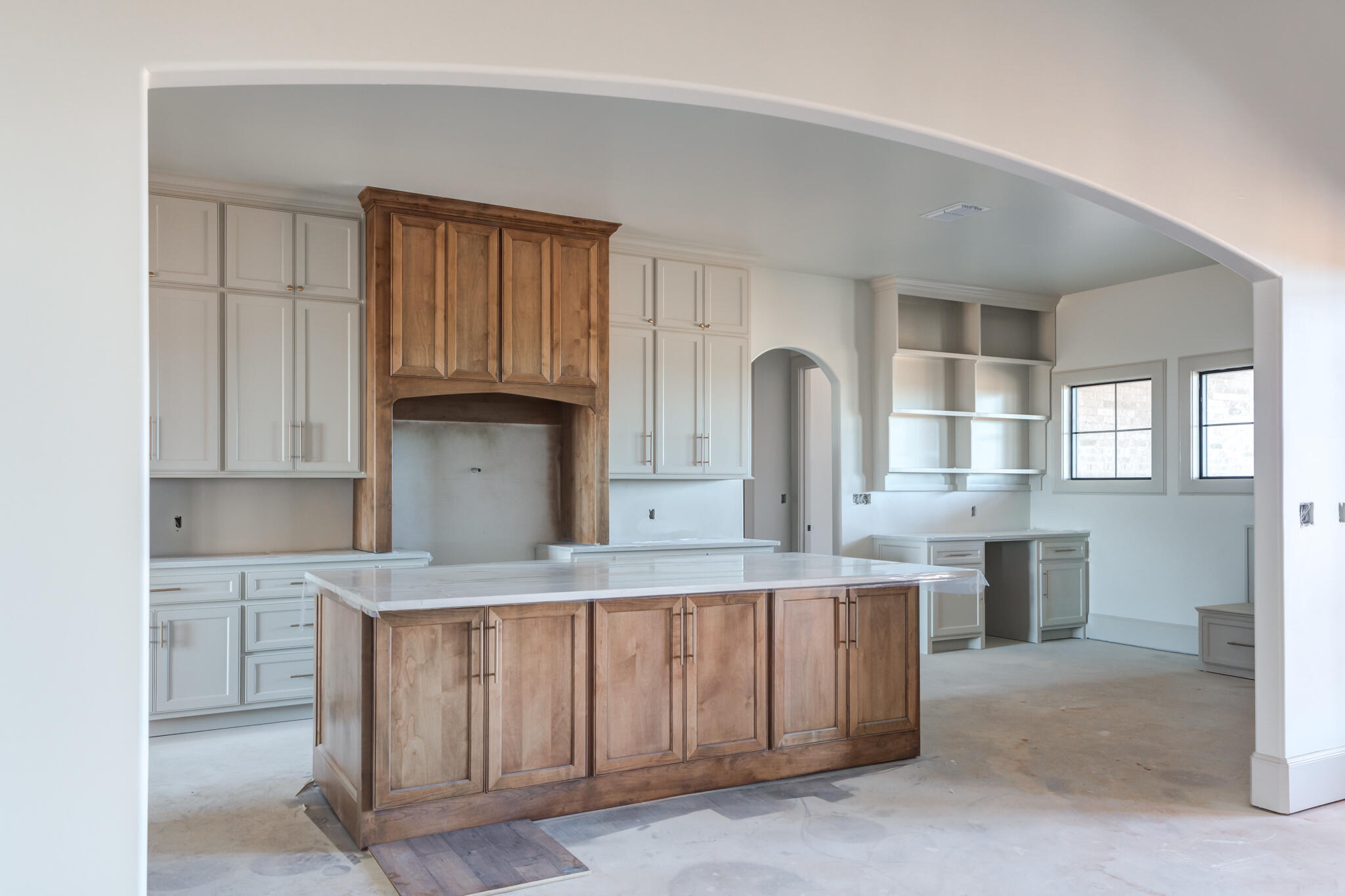 6309 Foster Road Ropesville, TX 79358 - Photo 4 of 38 a kitchen with kitchen island granite countertop a stove top oven a sink and dishwasher with white cabinets