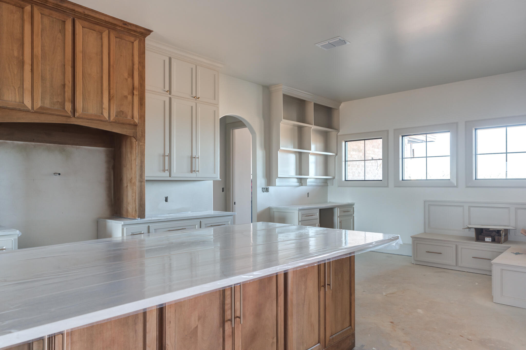 6309 Foster Road Ropesville, TX 79358 - Photo 6 of 38 a kitchen with stainless steel appliances granite countertop a sink and white cabinets