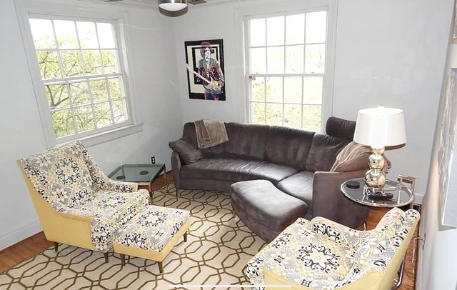 a living room with furniture and window