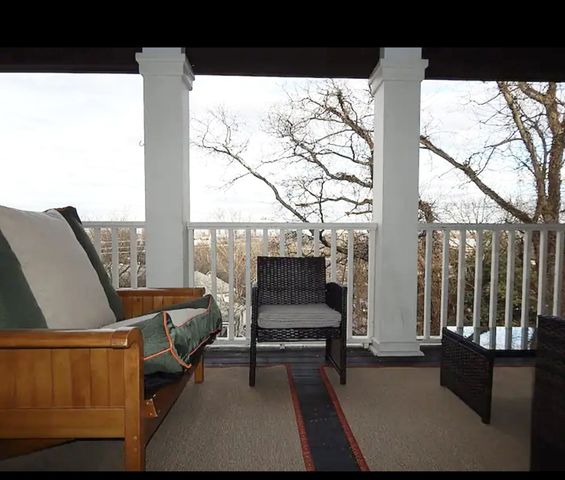 a view of a house with a tree