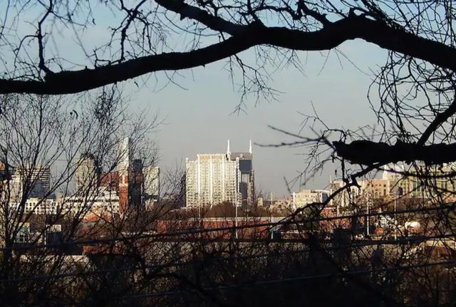 a street sign that is on a wooden deck
