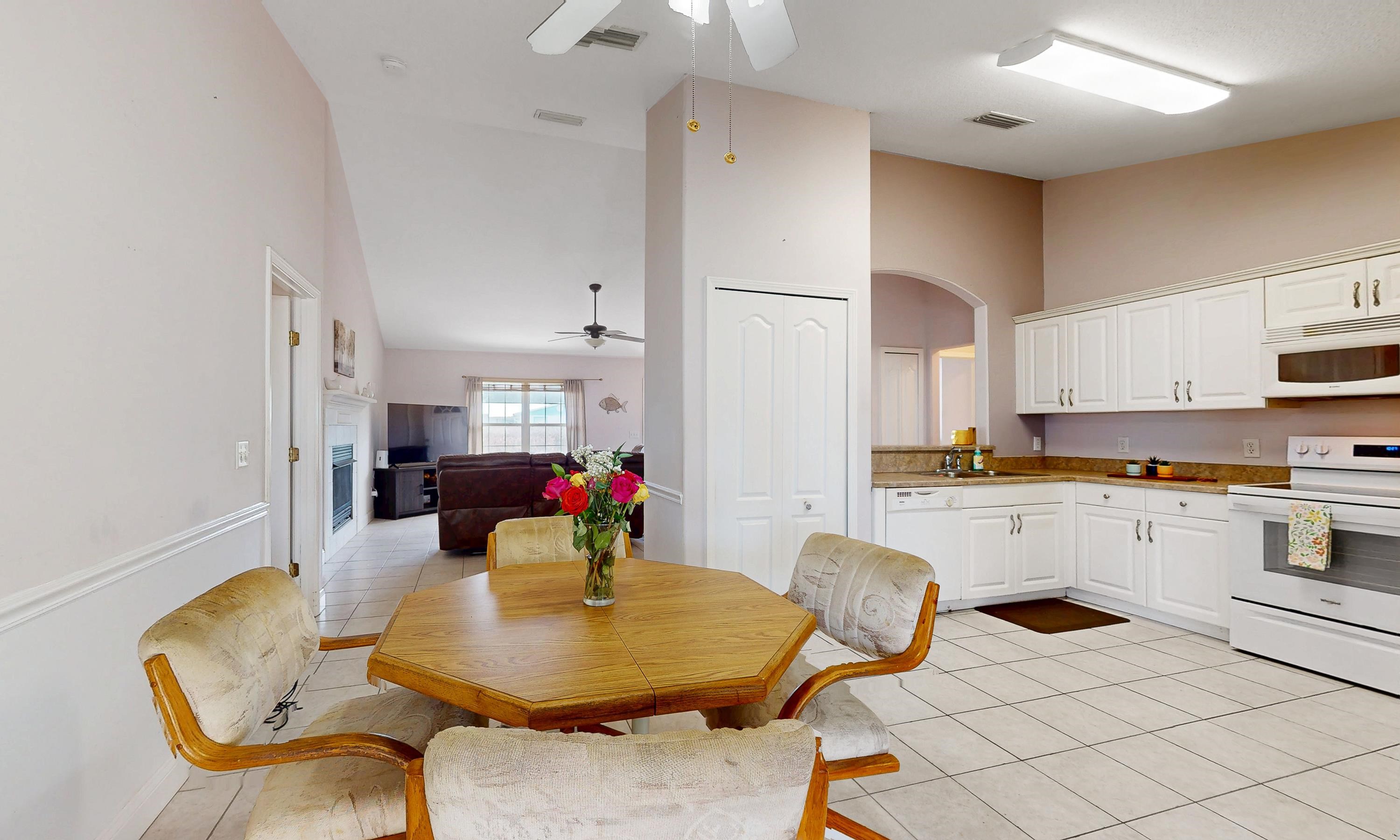330 Segovia Road St. Augustine, FL 32086 - Photo 12 of 52 a living room with kitchen island furniture and white appliances