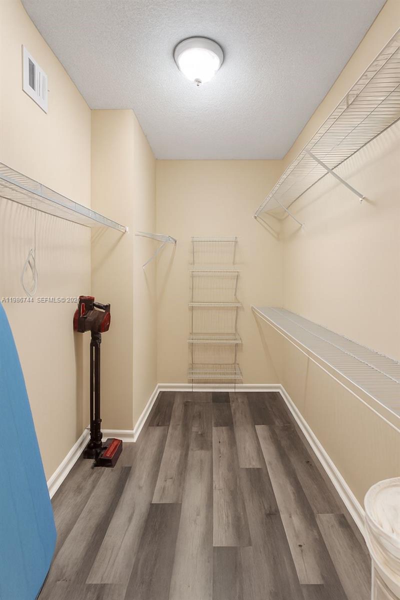 17150 North Bay Road, Unit 2122 Sunny Isles Beach, FL 33160 - Photo 11 of 19 a view of empty room with wooden floor