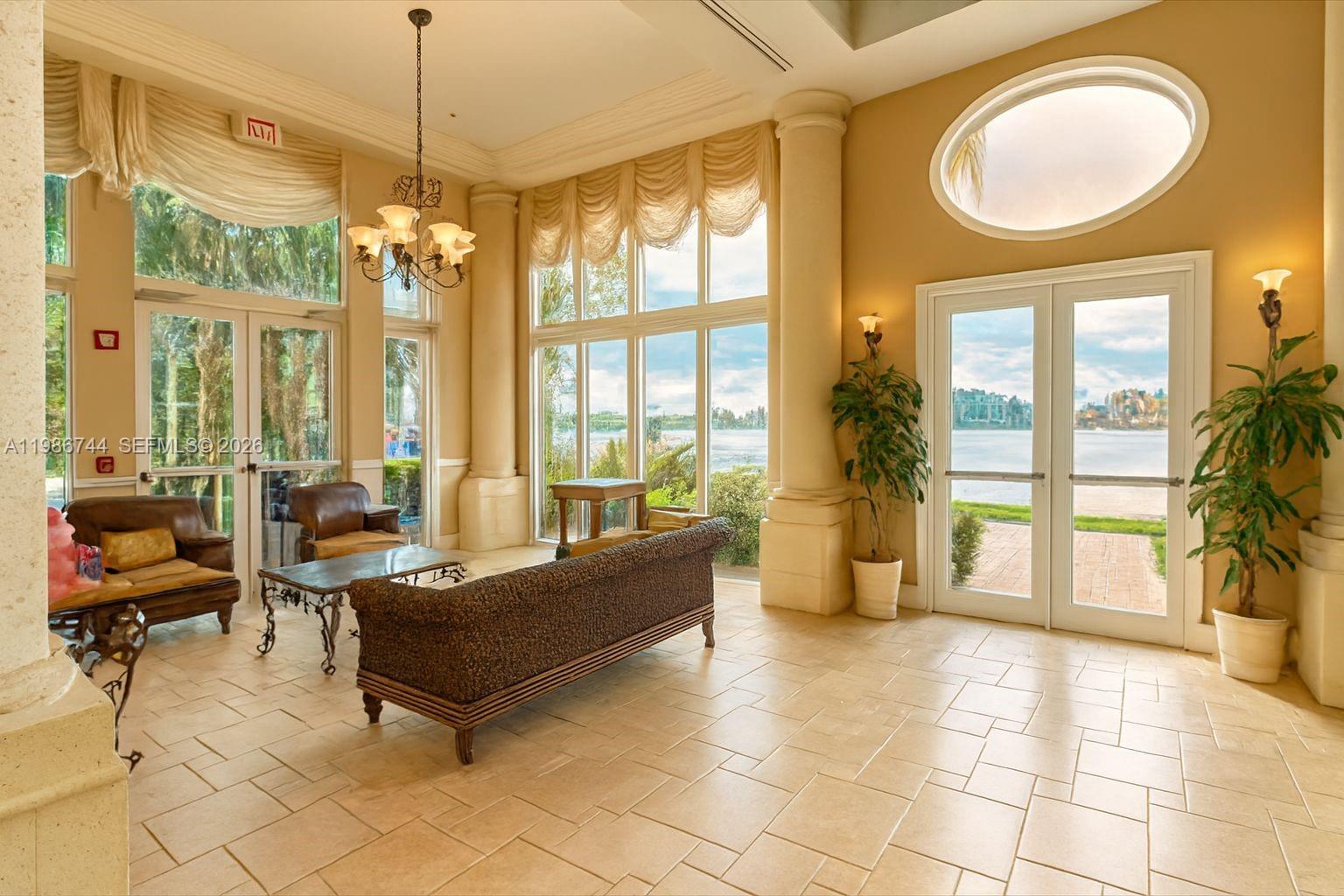 17150 North Bay Road, Unit 2122 Sunny Isles Beach, FL 33160 - Photo 14 of 19 a living room with furniture and a large window