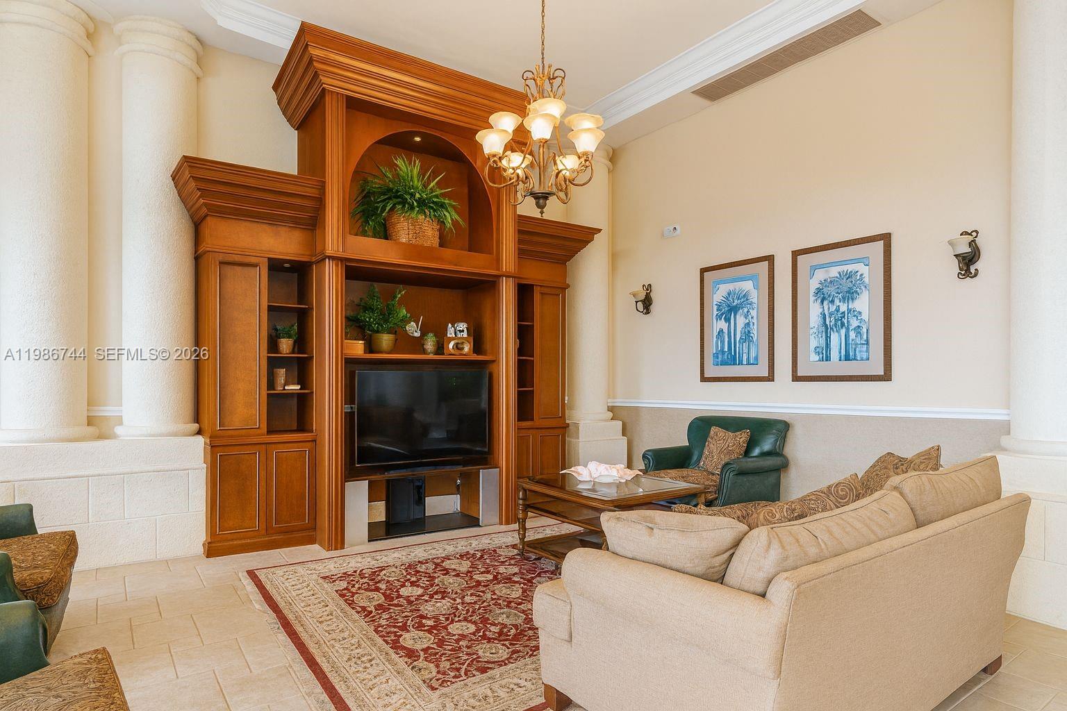 17150 North Bay Road, Unit 2122 Sunny Isles Beach, FL 33160 - Photo 16 of 19 a living room with furniture a window and a flat screen tv