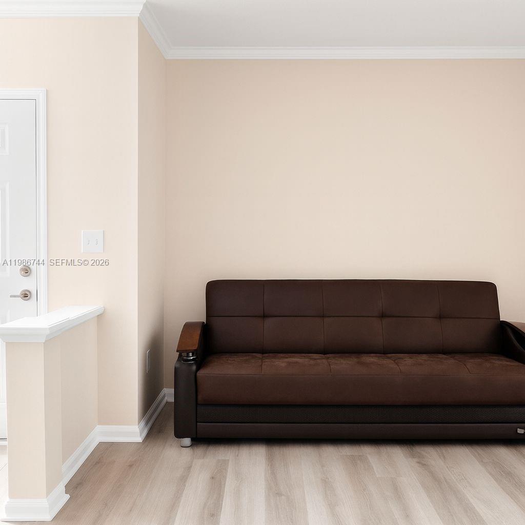 17150 North Bay Road, Unit 2122 Sunny Isles Beach, FL 33160 - Photo 5 of 19 a living room with a couch