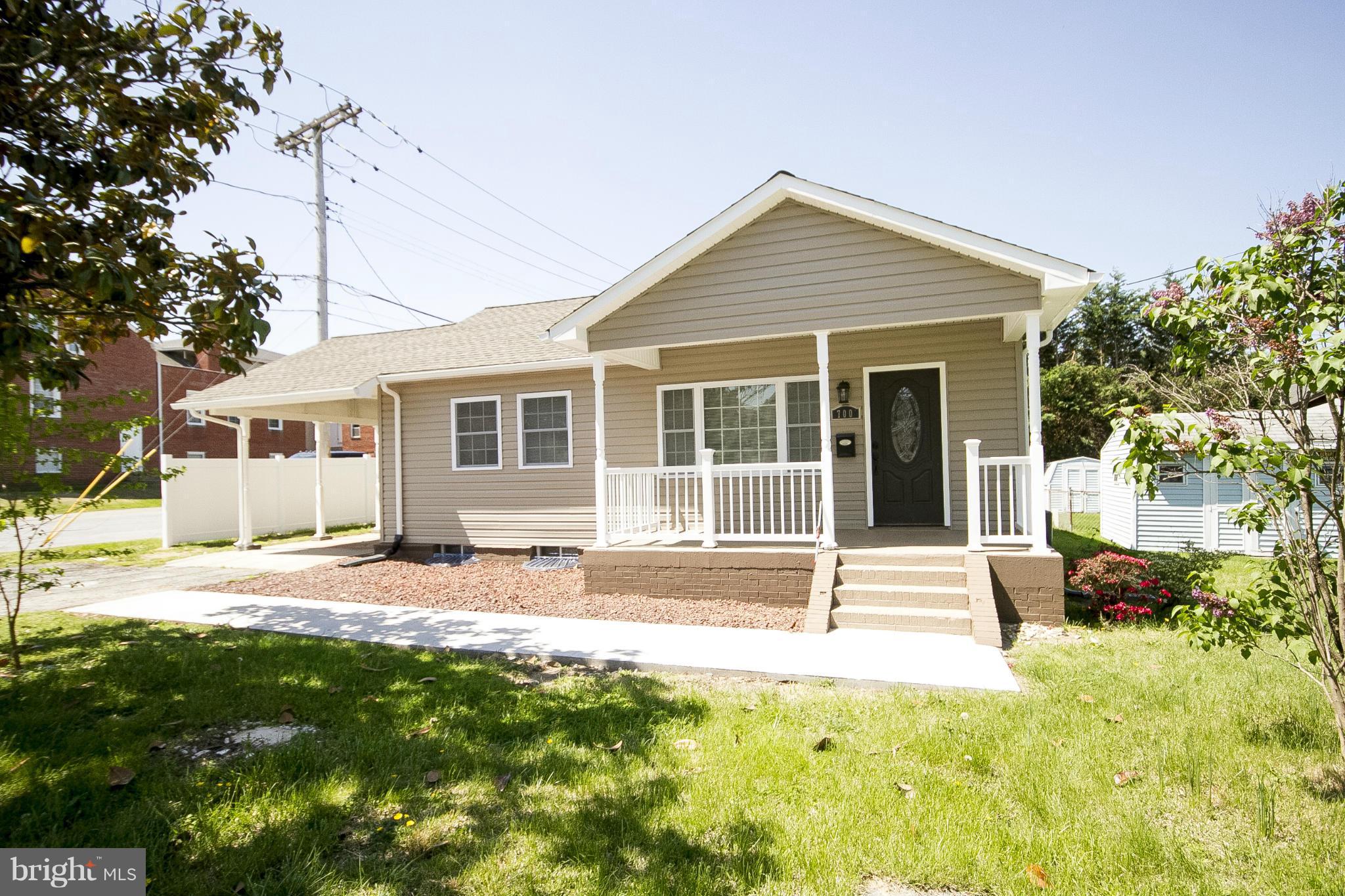 700 Middle River Road Baltimore, MD 21220 - Photo 1 of 29 a view of a house with yard and sitting area