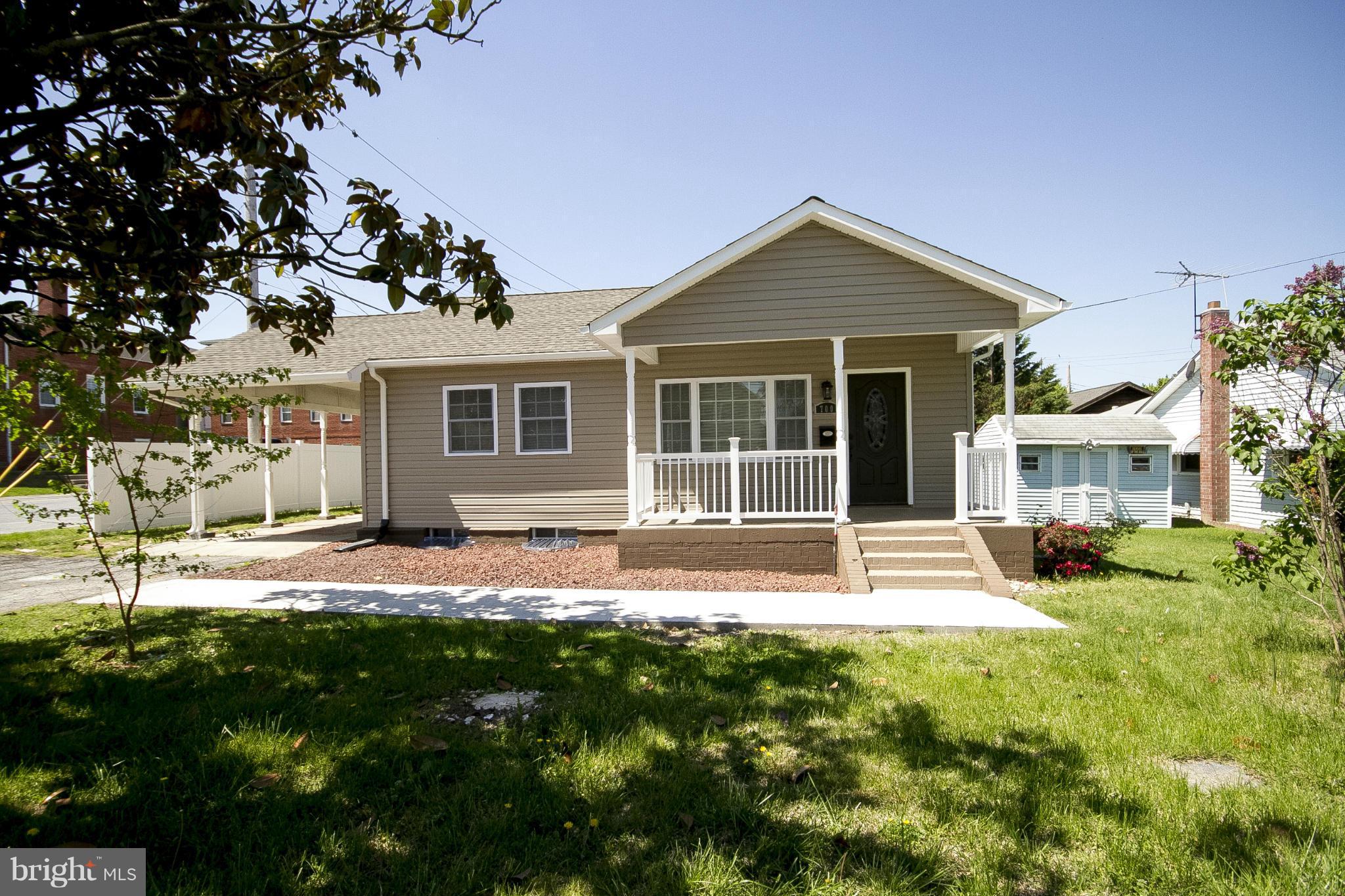 700 Middle River Road Baltimore, MD 21220 - Photo 2 of 29 a view of a house with a yard and large tree
