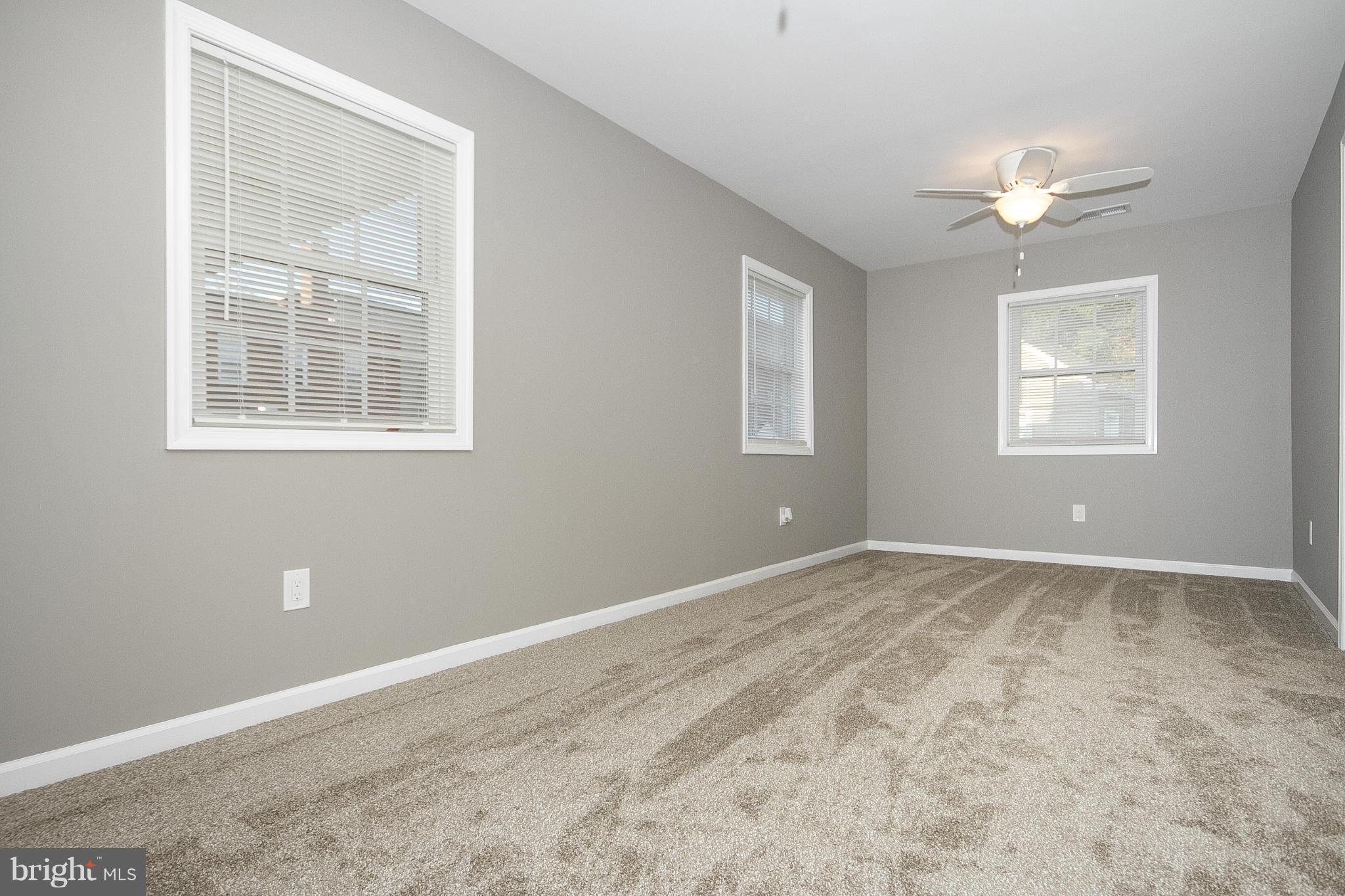 700 Middle River Road Baltimore, MD 21220 - Photo 13 of 29 a view of an empty room with a window