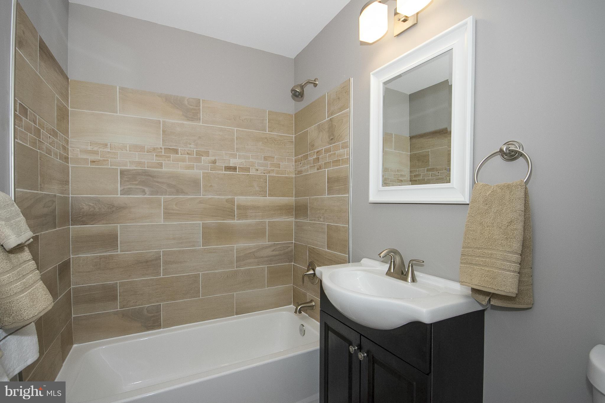 700 Middle River Road Baltimore, MD 21220 - Photo 17 of 29 a bathroom with a sink toilet and shower
