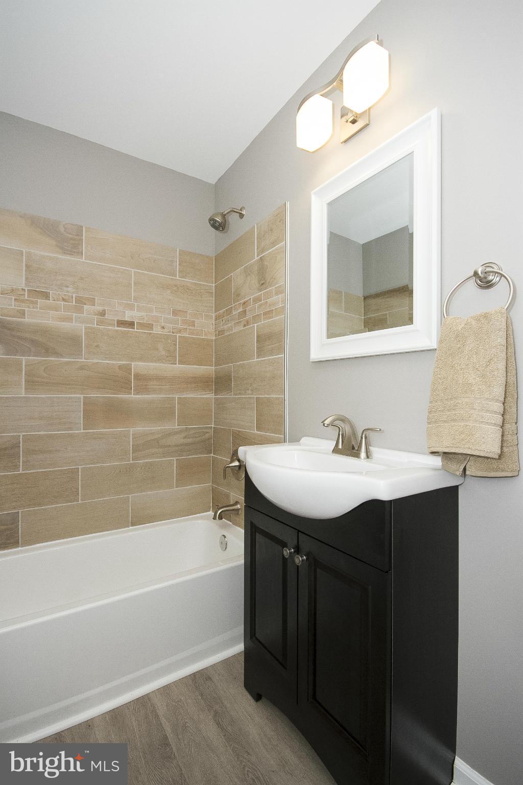 700 Middle River Road Baltimore, MD 21220 - Photo 18 of 29 a bathroom with a sink and a mirror