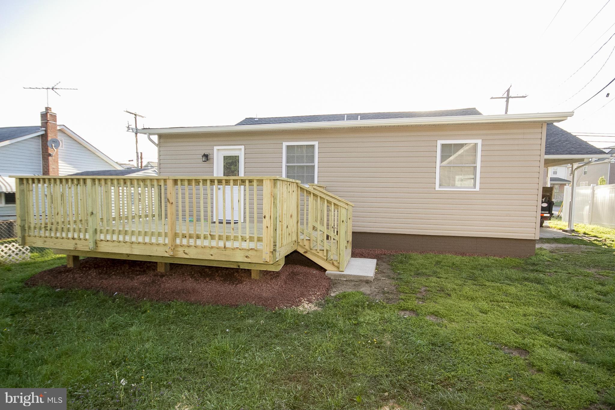 700 Middle River Road Baltimore, MD 21220 - Photo 27 of 29 a view of a house with a yard