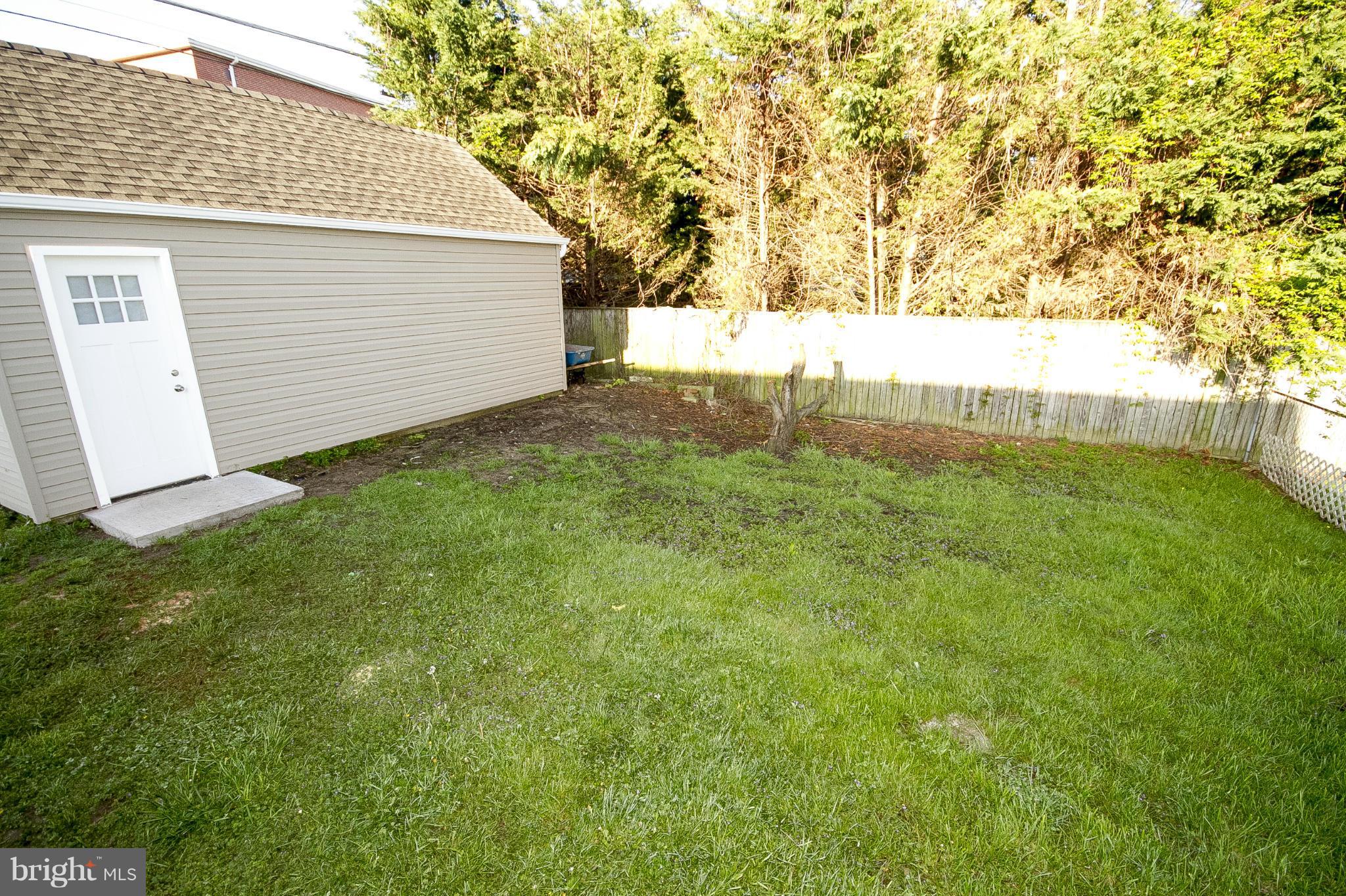 700 Middle River Road Baltimore, MD 21220 - Photo 28 of 29 a view of backyard with trampoline